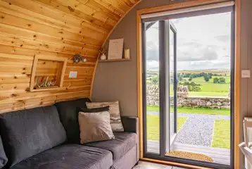 Eden glamping pod sofa and views