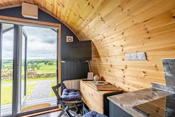 Willow glamping pod TV and seating area