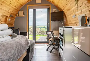 Alanna glamping pod interior and TV