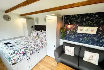 Willow glamping lodge king size bed and sofa Willow glamping lodge king size bed and sofa