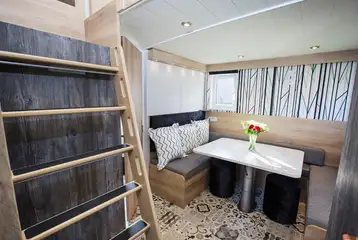 Glamping cabin dining area and steps to mezzanine level Glamping cabin dining area and steps to mezzanine level