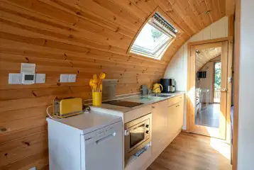 Alpaca pod with hot tub kitchen area