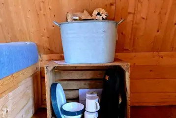 Includes tableware and a basket of logs