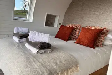 Usk glamping bedroom with bedding and towels provided Usk glamping bedroom with bedding and towels provided
