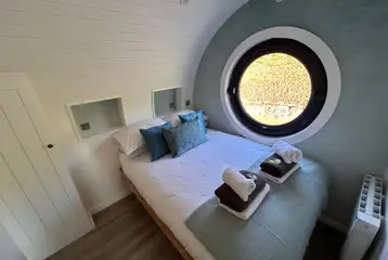 Usk glamping bedroom with bedding and towels provided Usk glamping bedroom with bedding and towels provided